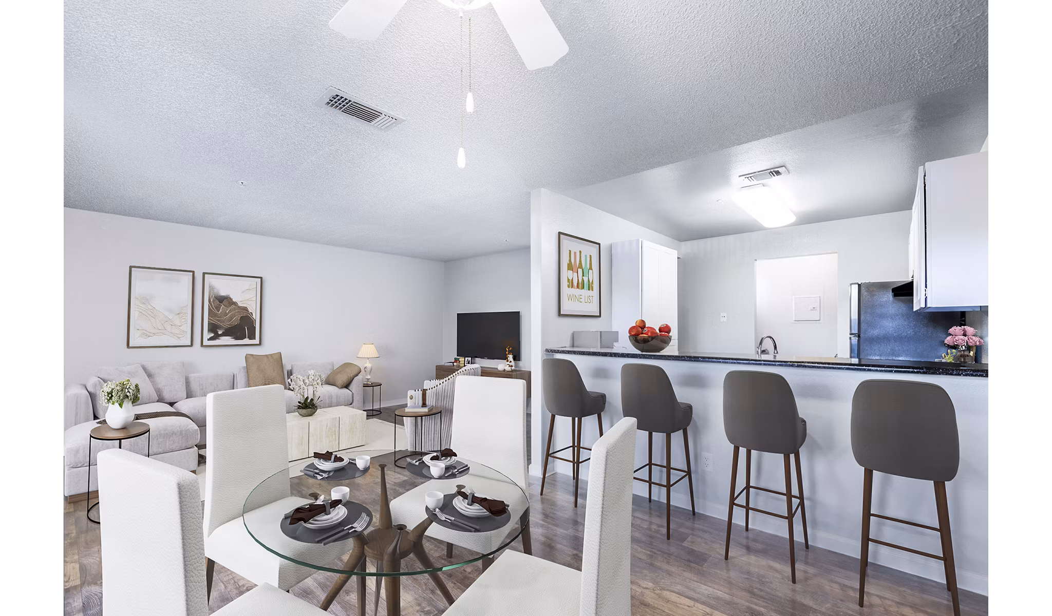 Dining area with modern furnishings and large windows in Vista Oaks Apartments