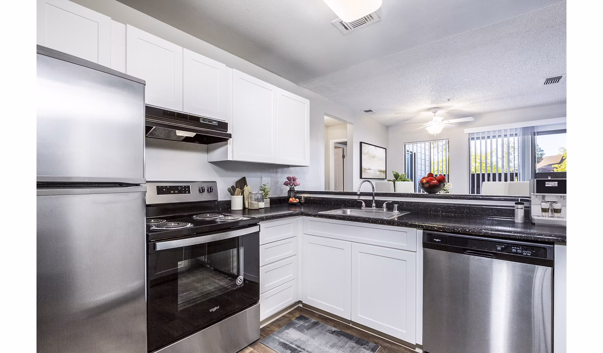 Modern kitchen with sleek countertops and stainless appliances in Vista Oaks Apartments