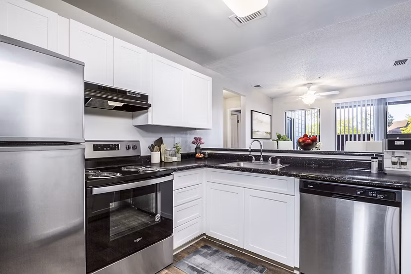 Modern kitchen with sleek countertops and stainless appliances in Vista Oaks Apartments