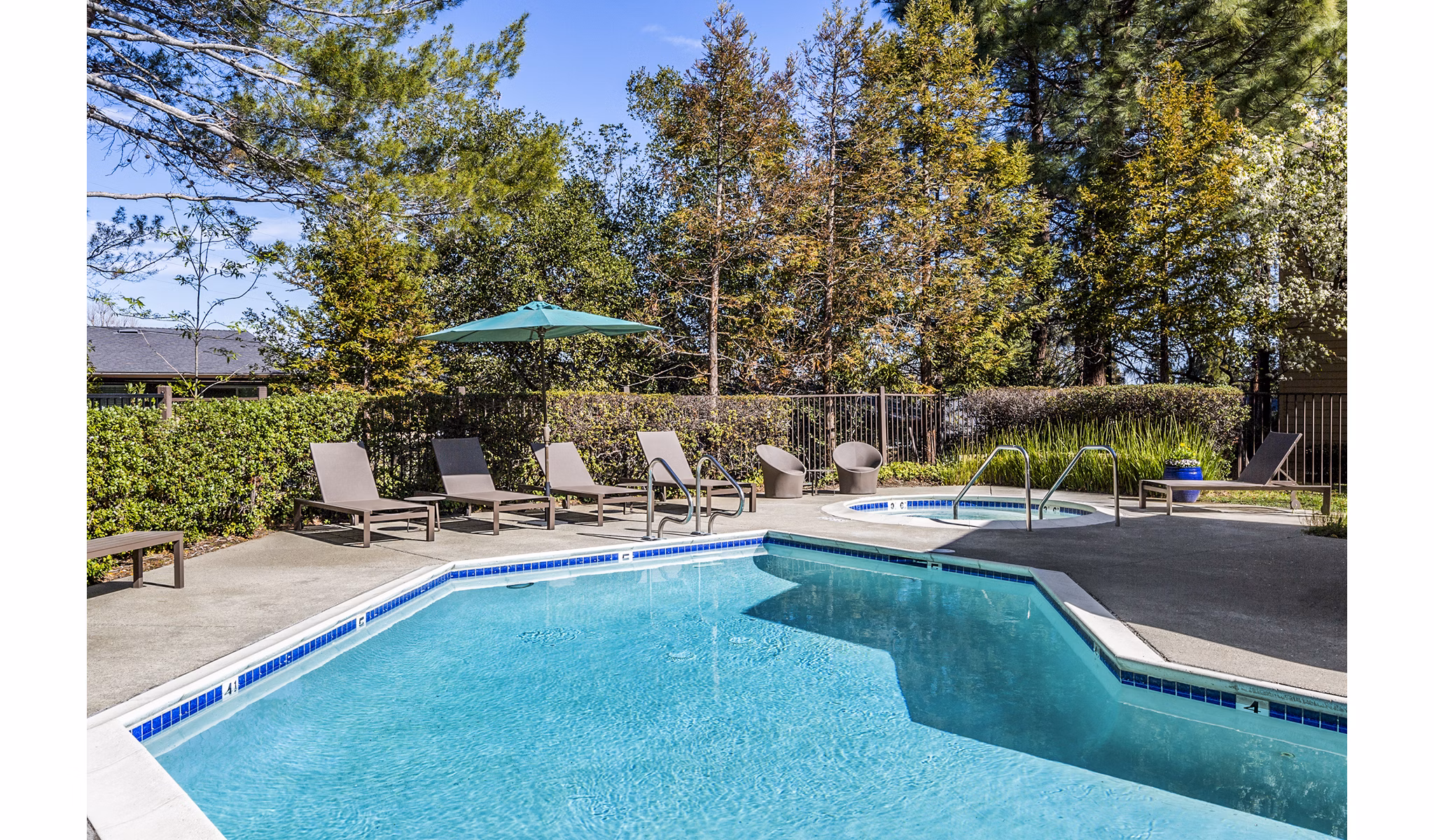Relaxing outdoor pool area at Vista Oaks Apartments providing luxury leisure amenities