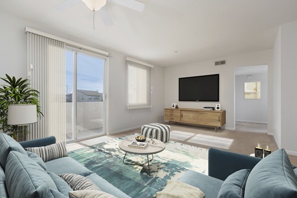 Spacious living room with modern dÃ©cor at the Villas at Monterosso apartments