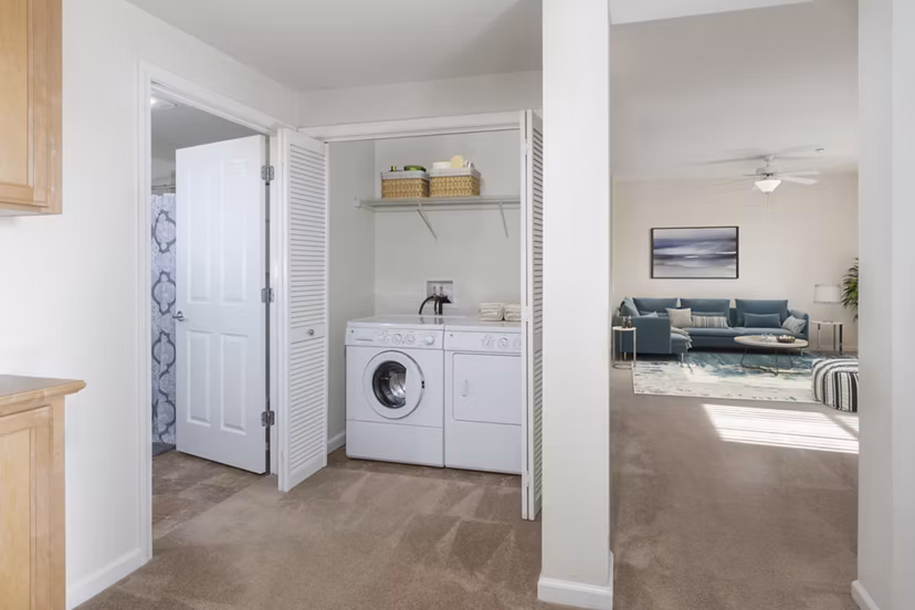 Laundry room with modern appliances at the Villas at Monterosso luxury apartments