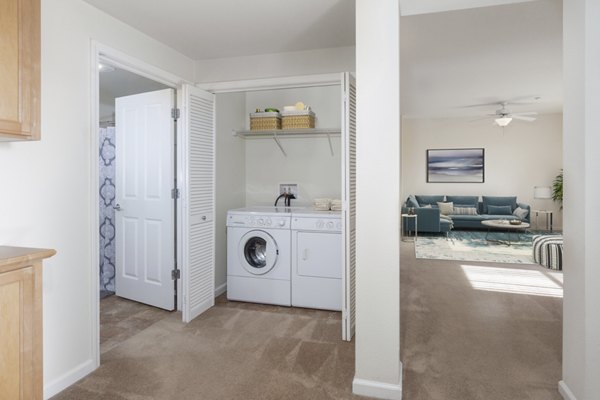 Laundry room with modern appliances at the Villas at Monterosso luxury apartments
