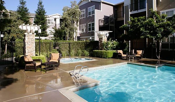 Luxurious pool area surrounded by cabanas at Morgan Park Apartments: upscale living in serene community