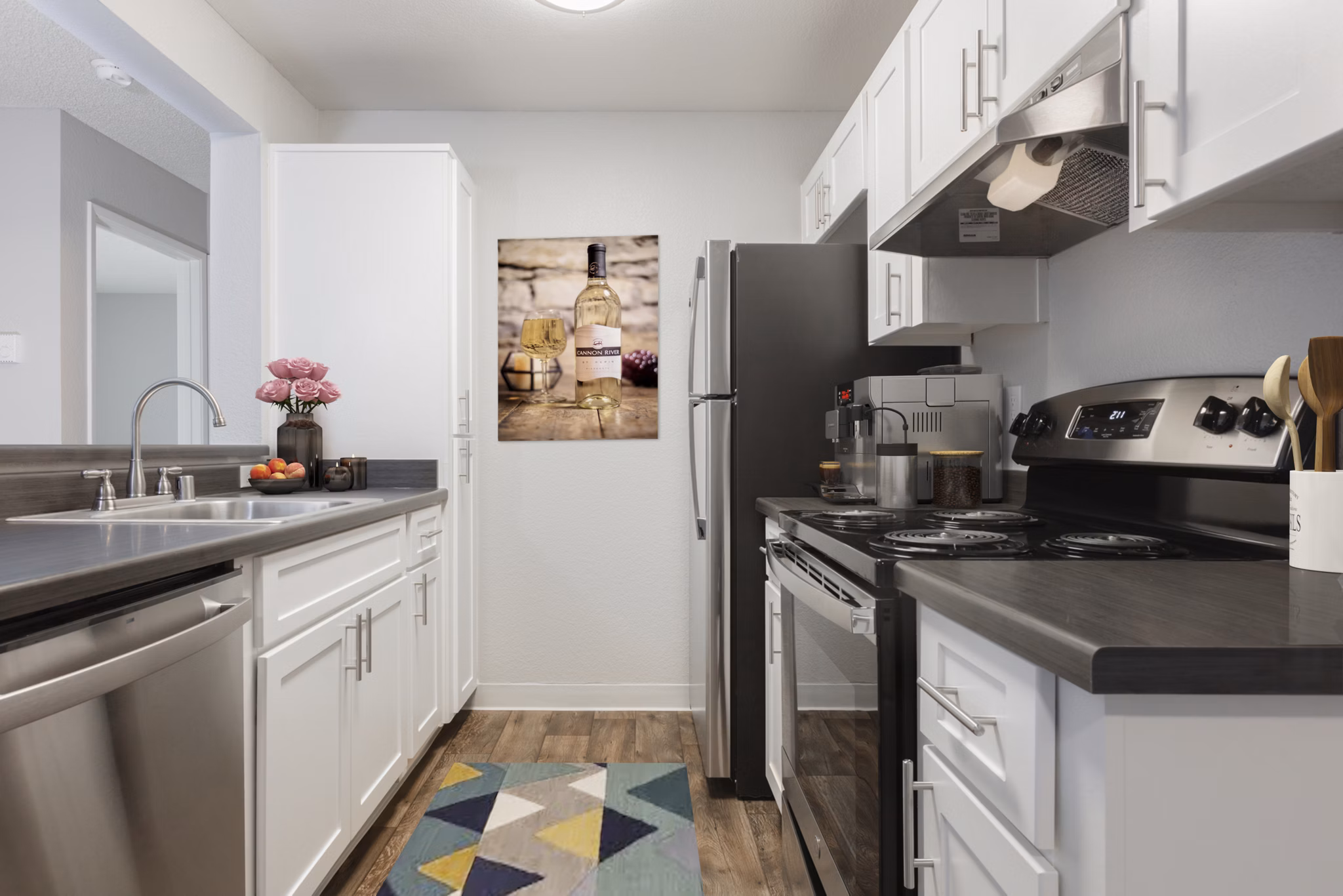 Sleek kitchen featuring modern appliances and granite countertops in Autumn Springs Apartments