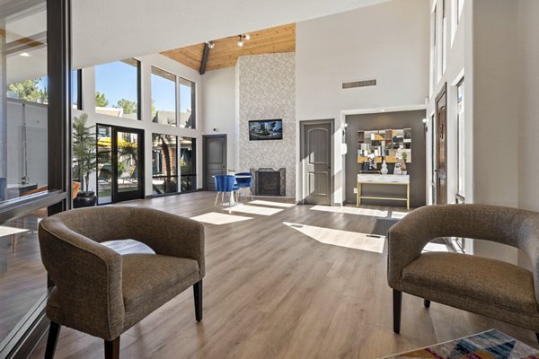 Clubhouse with modern design and comfortable seating at The Bella Apartments, a Greystar luxury community