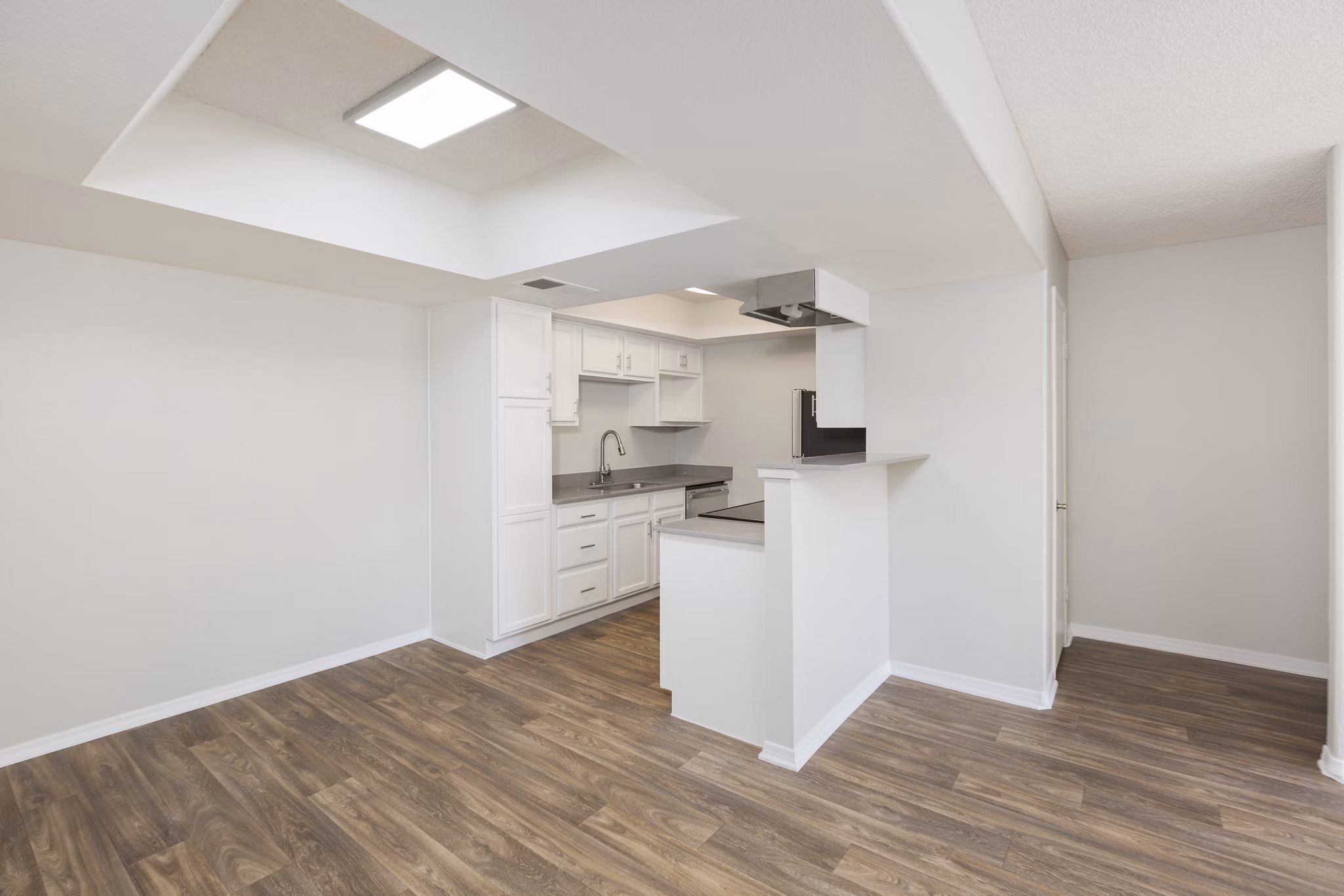 The Bella Apartments: Modern dining room with sleek finishes and natural lighting
