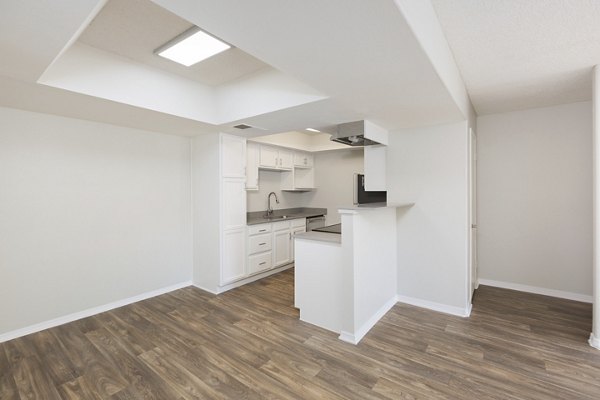 The Bella Apartments: Modern dining room with sleek finishes and natural lighting