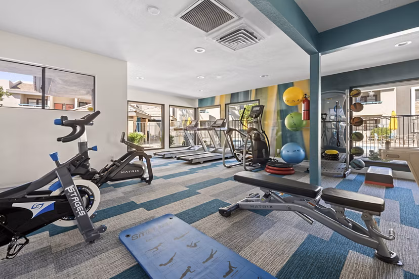 Modern fitness center with top-of-the-line equipment at The Bella Apartments
