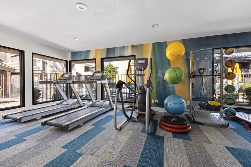 State-of-the-art fitness center with modern equipment at The Bella Apartments, promoting healthy living and wellness