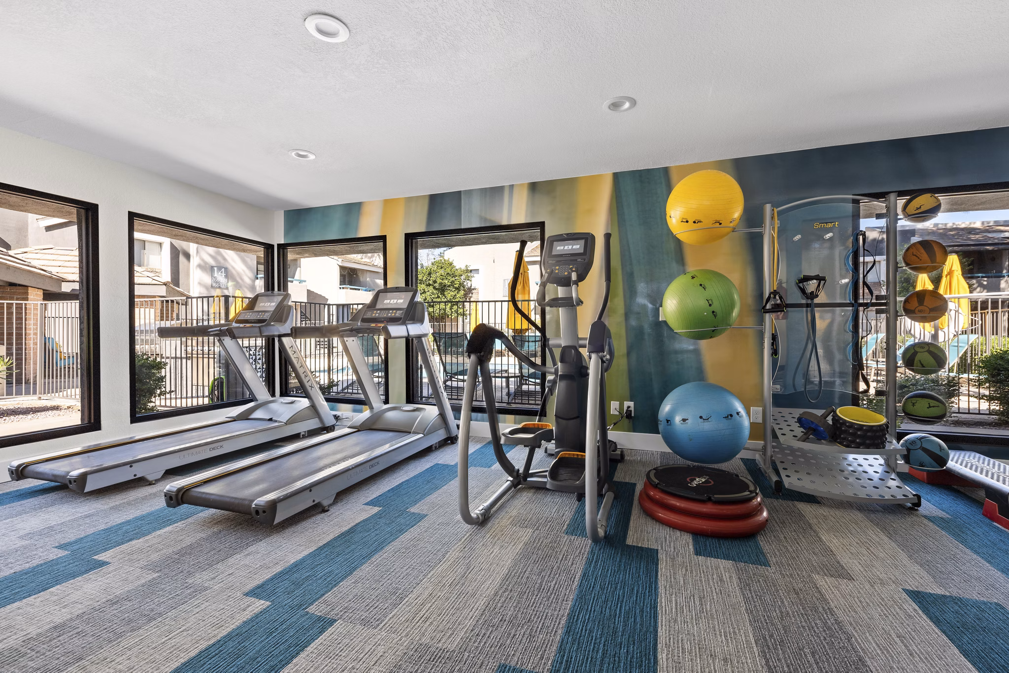 State-of-the-art fitness center with modern equipment at The Bella Apartments, promoting healthy living and wellness