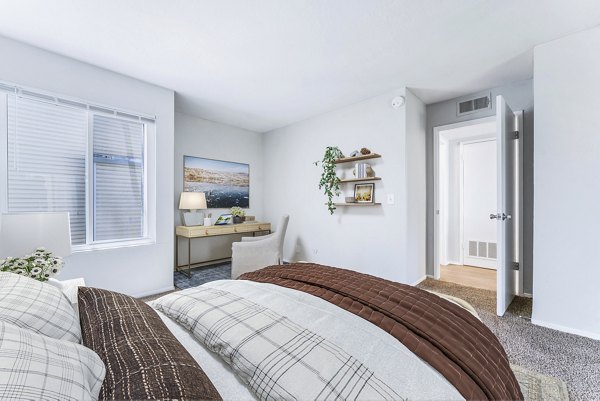 Cozy bedroom with modern decor at Kensington Apartments