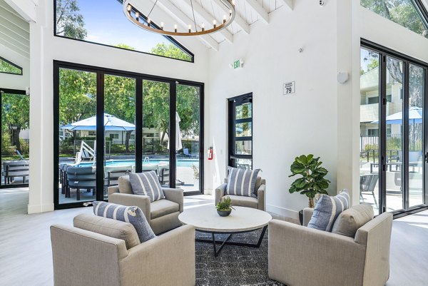 Kensington Apartments: Elegant clubhouse with modern decor and comfortable seating in a luxury community