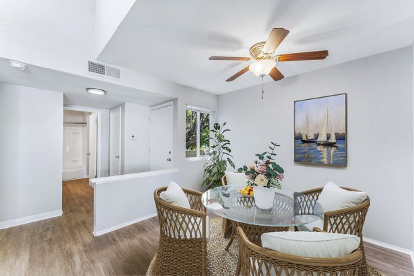 Dining room featuring modern furnishings and elegant lighting at Kensington Apartments