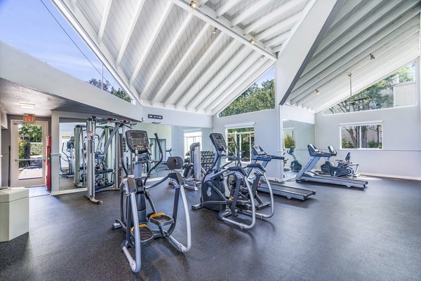 Fitness center with modern equipment at Kensington Apartments