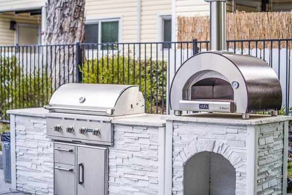 Spacious grill area on patio at Kensington Apartments offering an outdoor cooking experience for residents