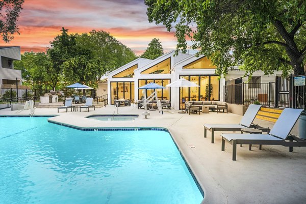 Sparkling outdoor pool at Kensington Apartments, a Greystar luxury community offering relaxing leisure spots