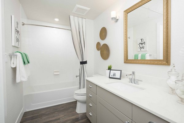Modern bathroom with sleek fixtures at Highlands 32 Apartments, Greystar luxury property in an upscale setting