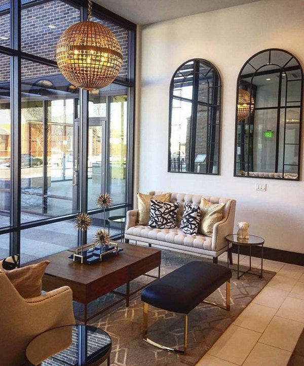 Clubhouse with modern decor and seating at Highlands 32 Apartments, offering a community space for residents