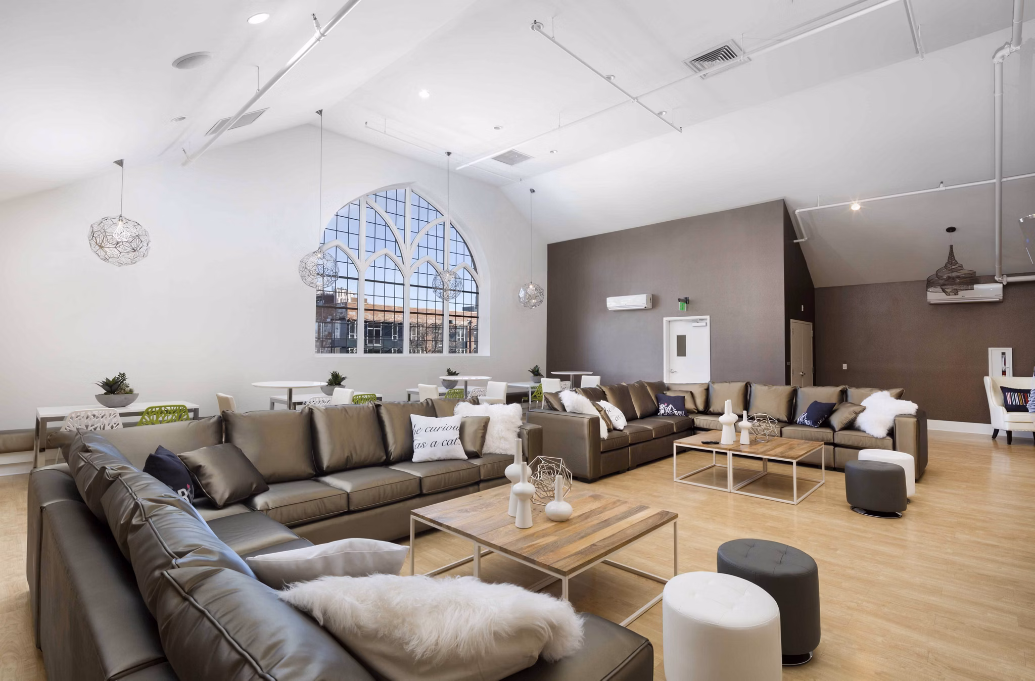 Modern clubhouse with cozy seating and fireplace at Highlands 32 Apartments, offering luxury living in Greystar's premier community