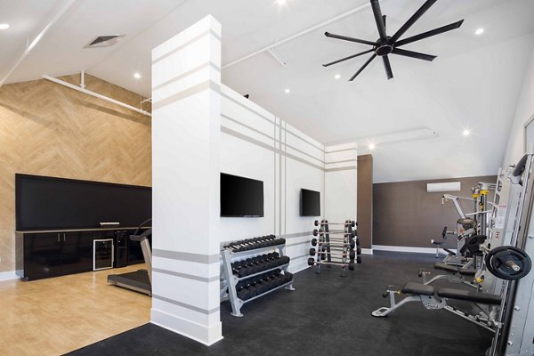 State-of-the-art fitness center with modern equipment at Highlands 32 Apartments