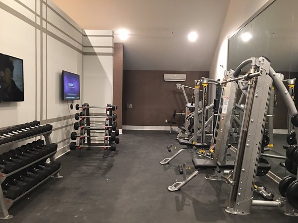Fitness center equipped with modern exercise machines at Highlands 32 Apartments