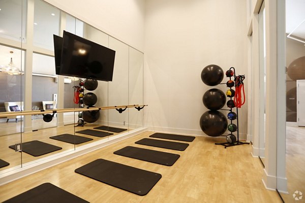 Modern yoga/spin studio with state-of-the-art equipment at Highlands 32 Luxury Apartments