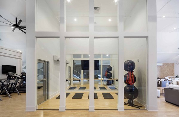 Modern yoga/spin studio with state-of-the-art equipment at Highlands 32 Apartments, luxury living in an active communityâ€