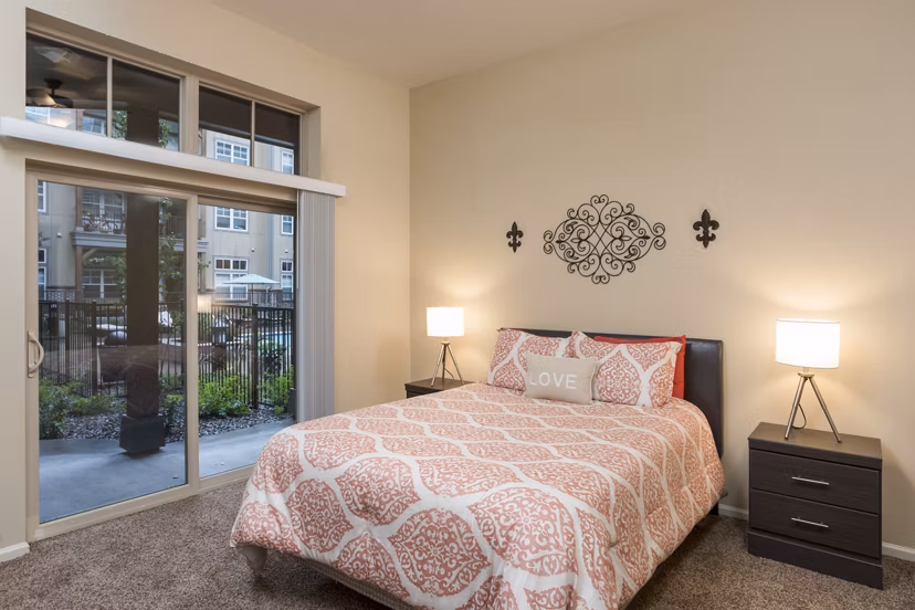 Elegant bedroom with modern furnishings at Village at Aspen Place Apartments, ideal for luxury living