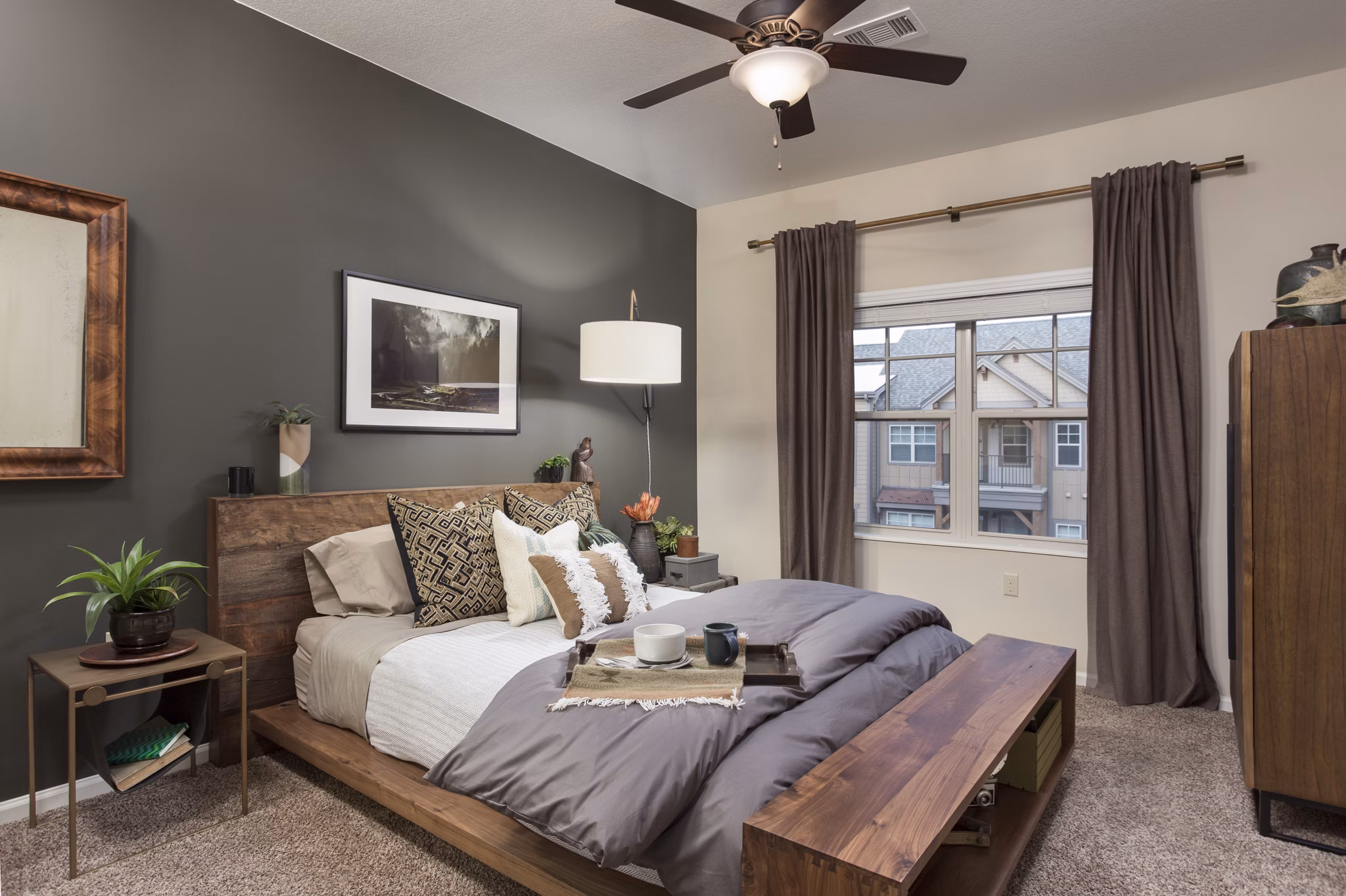 Bedroom with modern decor featuring plush bedding at Village at Aspen Place Apartments