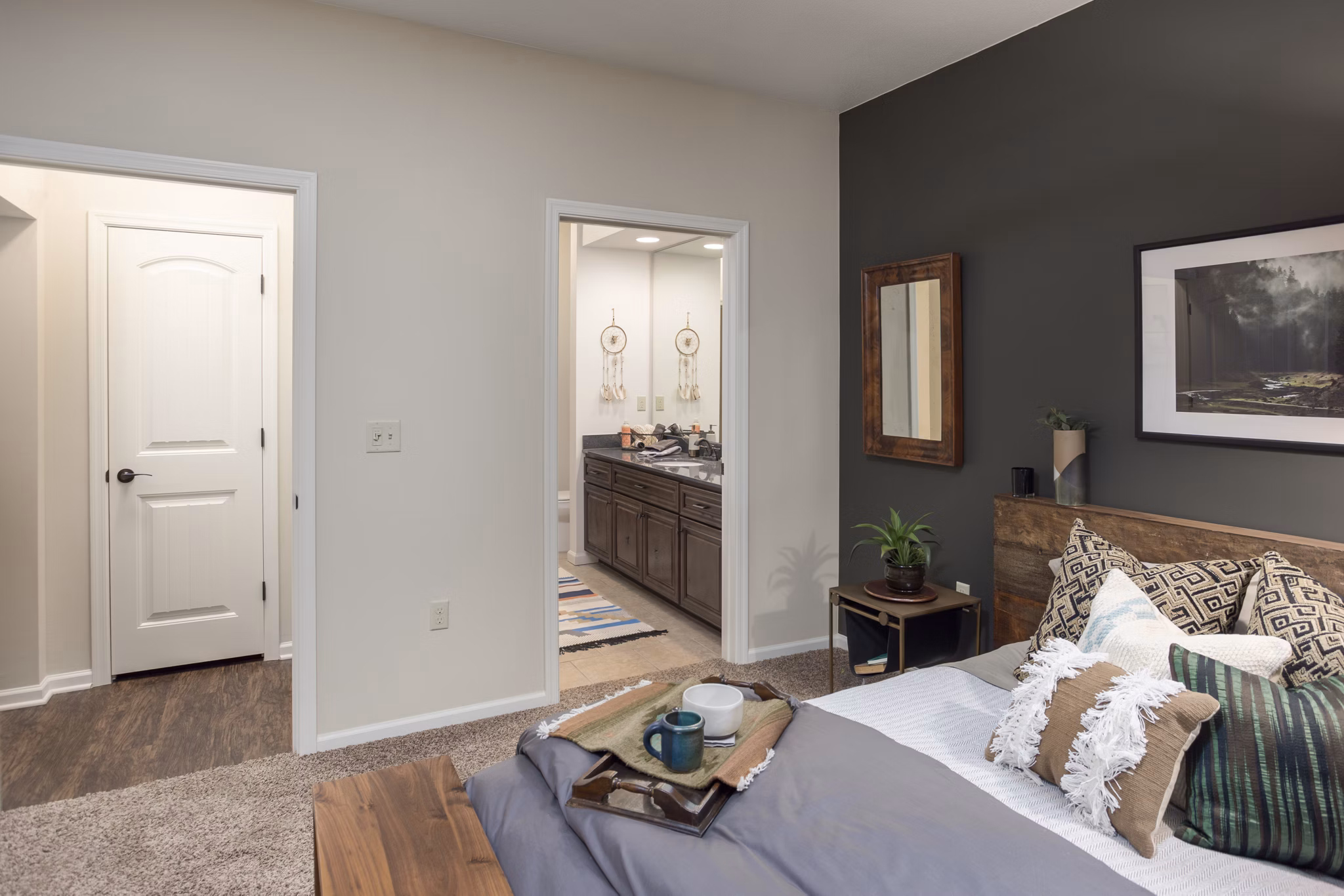 Cozy bedroom with modern furnishings at Village at Aspen Place Apartments in Flagstaff