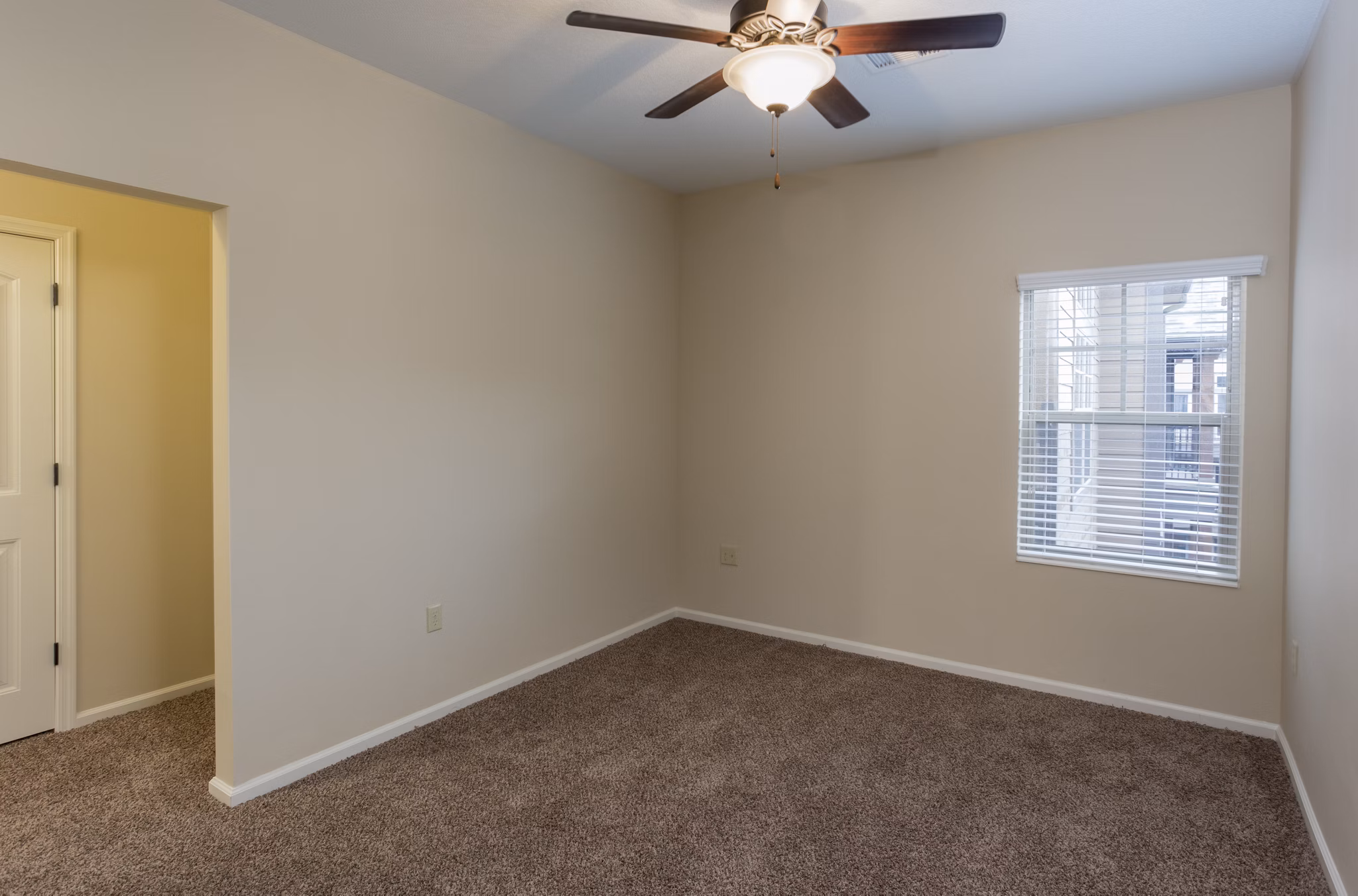Village at Aspen Place: Cozy bedroom with mountain views and modern furnishings in luxury apartments