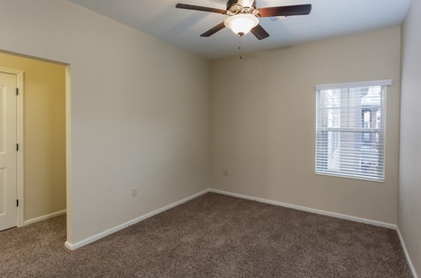 Village at Aspen Place: Cozy bedroom with mountain views and modern furnishings in luxury apartments