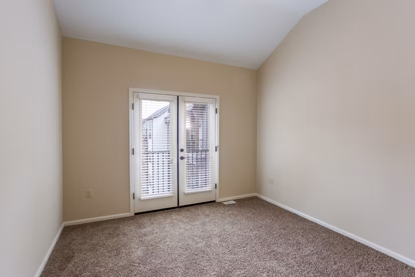 Cozy bedroom with stylish decor at Village at Aspen Place Apartments