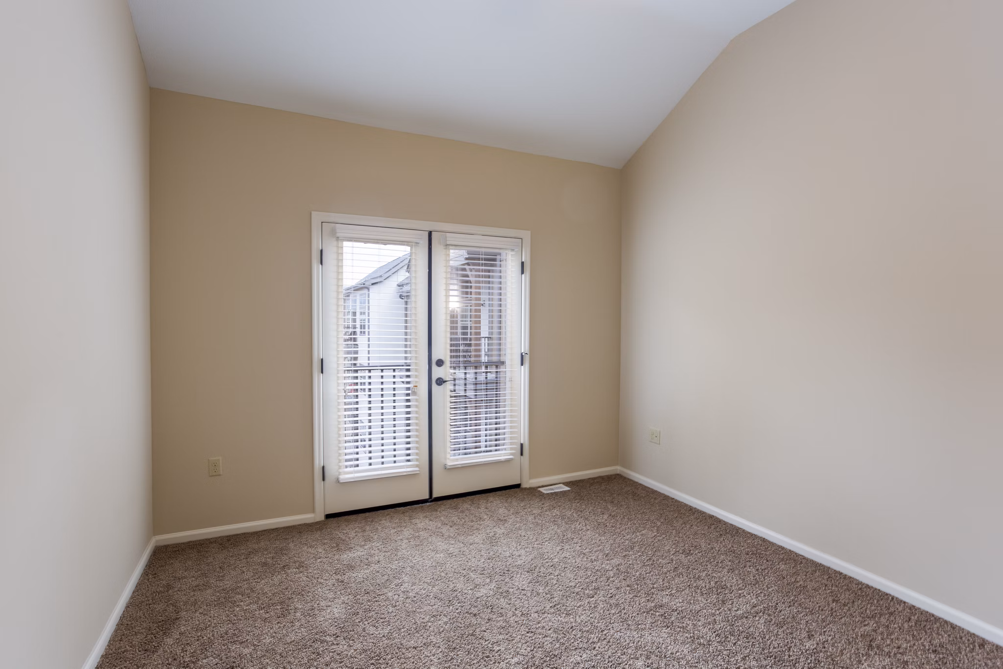 Cozy bedroom with stylish decor at Village at Aspen Place Apartments