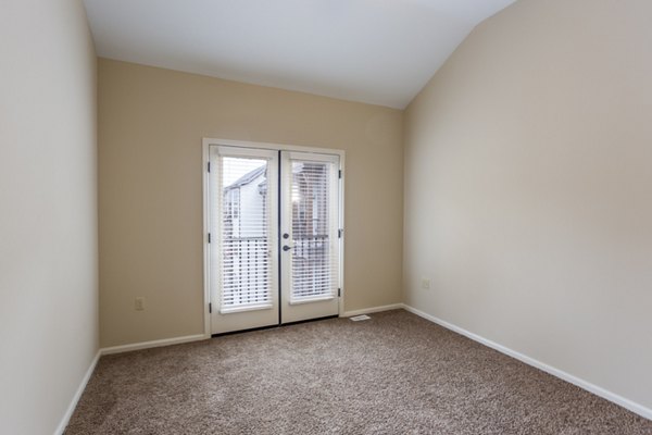 Cozy bedroom with stylish decor at Village at Aspen Place Apartments