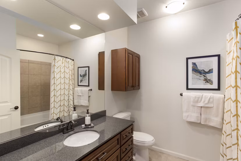 Bathroom featuring modern design and sleek fixtures at Village at Aspen Place Apartments