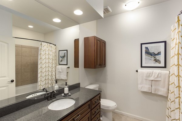 Bathroom featuring modern design and sleek fixtures at Village at Aspen Place Apartments