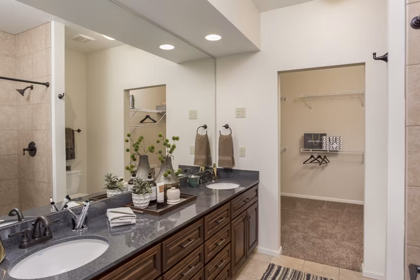 Bathroom with sleek fixtures at Village at Aspen Place luxury apartments