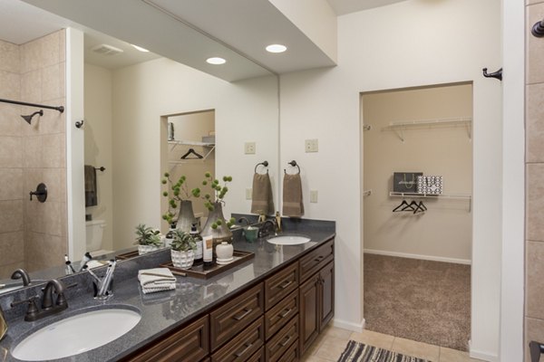 Bathroom with sleek fixtures at Village at Aspen Place luxury apartments