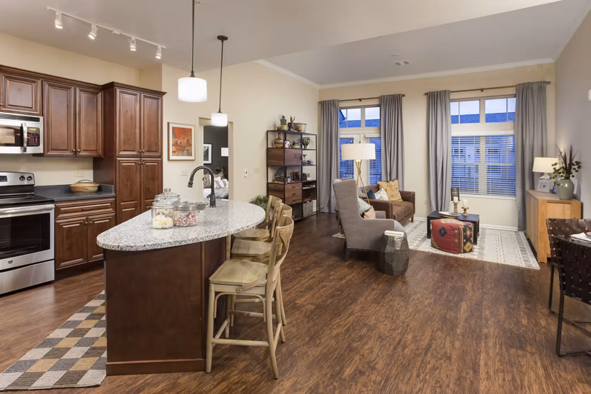 Modern kitchen featuring sleek countertops and stainless steel appliances at Village at Aspen Place Apartments