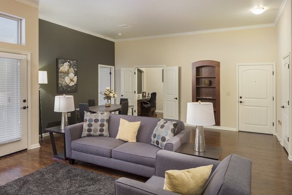 ing room at Village at Aspen Place Apartments