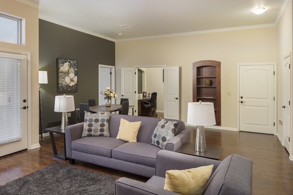 Spacious living room with modern decor at Village at Aspen Place Apartments