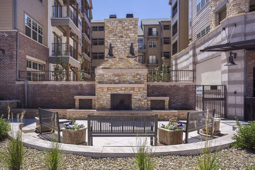 Cozy outdoor fire pit area at Village at Aspen Place Apartments