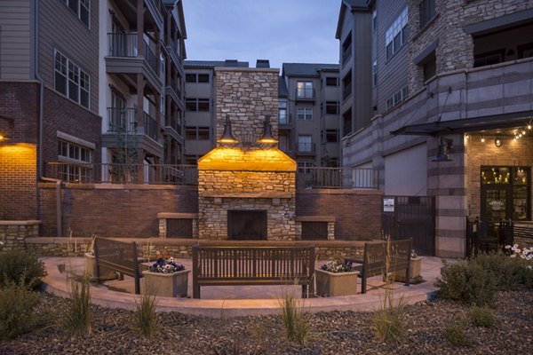 Fire pit with seating area at Village at Aspen Place Apartments, perfect for outdoor gatherings and relaxation