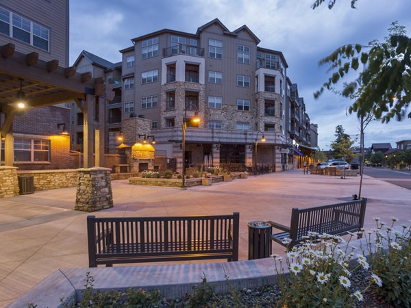 Village at Aspen Place: Serene courtyard with lush greenery and seating areas