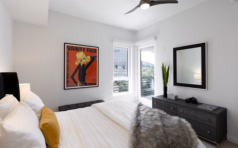 Cozy bedroom with modern furnishings at Talaria Apartments, showcasing luxury living at its finest