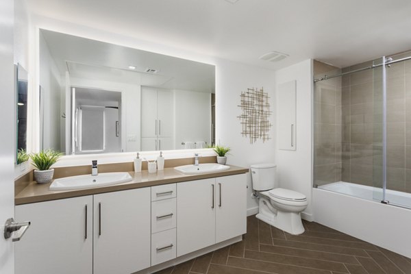 Luxurious bathroom with modern fixtures and elegant design at Talaria Apartments