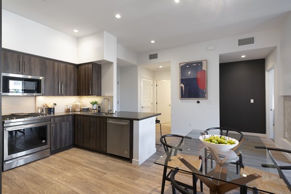 Modern kitchen with stainless steel appliances at Talaria Apartments