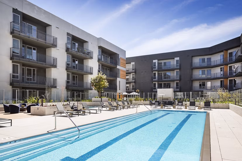 Luxurious pool with lounging area at Talaria Apartments, Greystar luxury community in Burbank